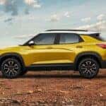 A yellow 2021 Chevy Trailblazer ACTIV parked off-road.