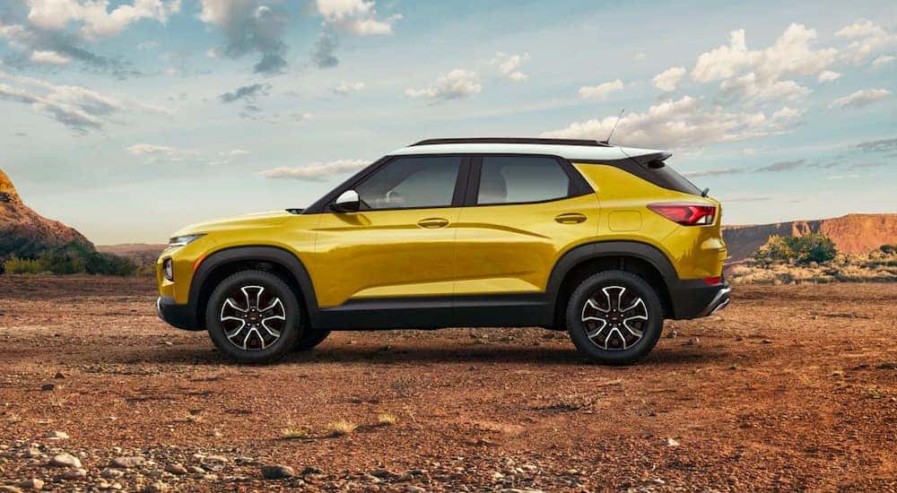 A yellow 2021 Chevy Trailblazer ACTIV parked off-road.