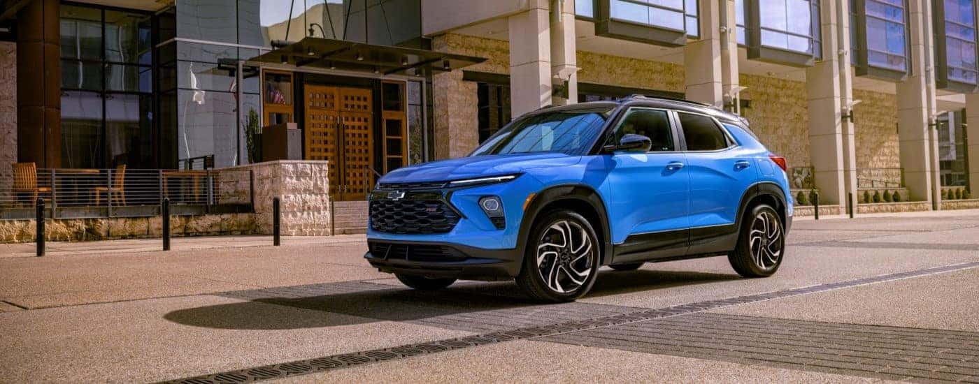 A blue 2024 Chevy Trailblazer RS parked in a city