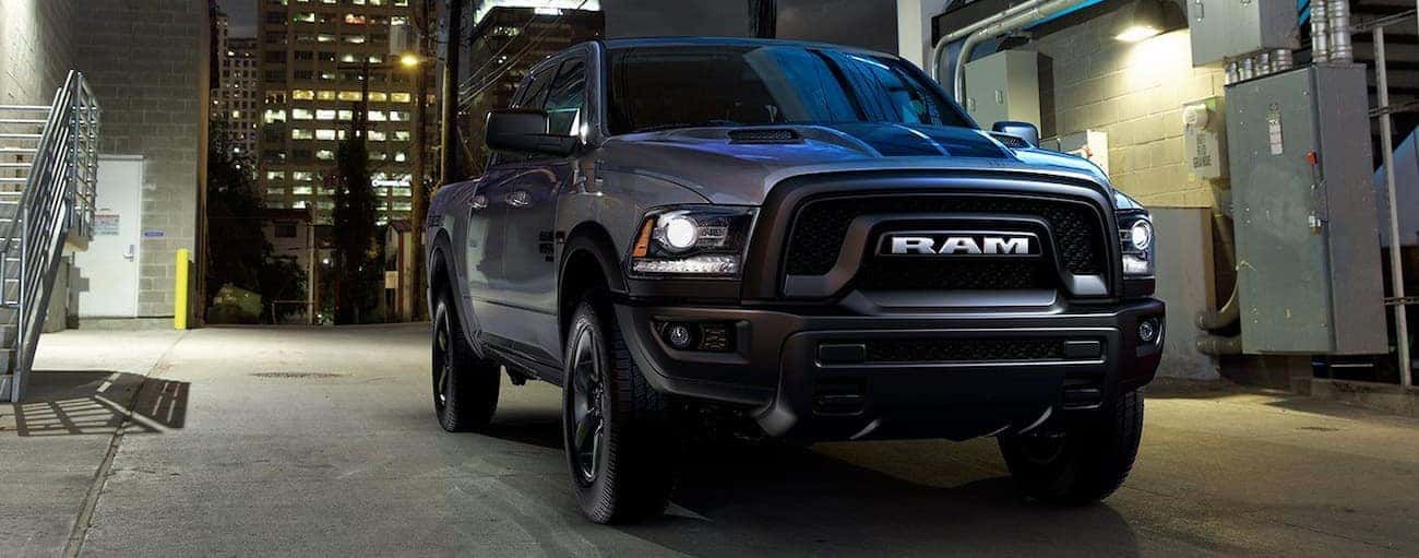 Black 2019 Ram 1500 Classic parked in an alley.