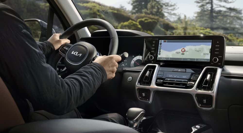 Person test driving a 2022 Kia Sorento for sale