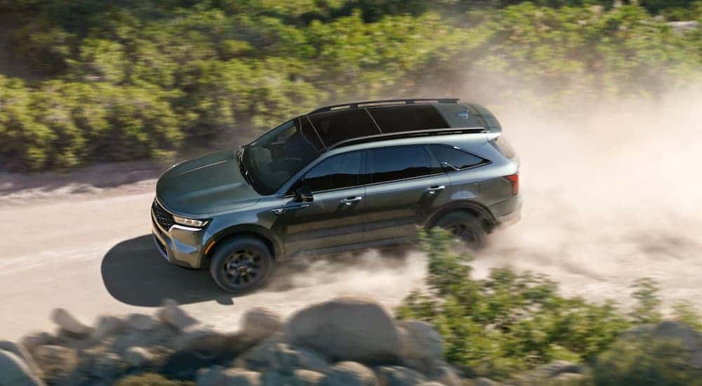 Grey 2022 Kia Sorento X driving on a dusty road