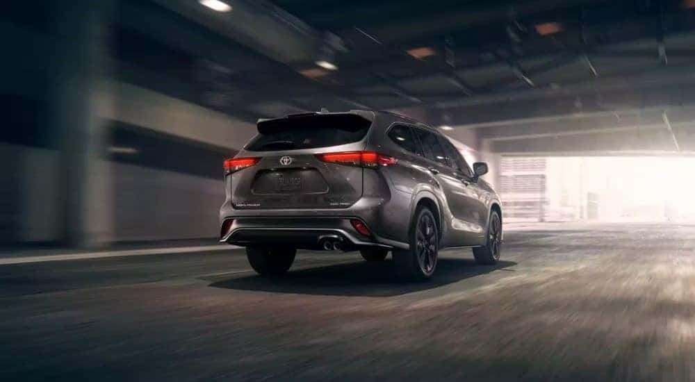 A silver 2022 Toyota Highlander XSE driving in a tunnel