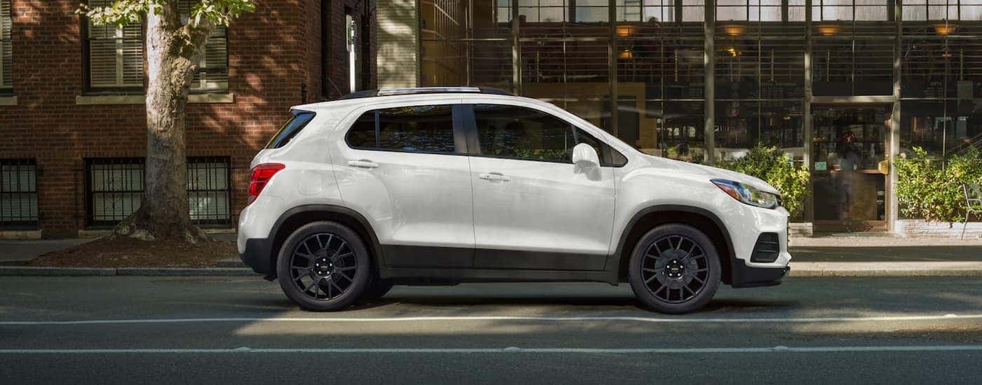 A white 2022 Chevy Trax parked in a city