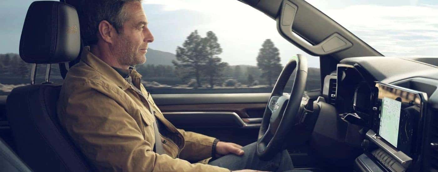 A man using SuperCruise on a used 2024 Chevy Silverado 1500