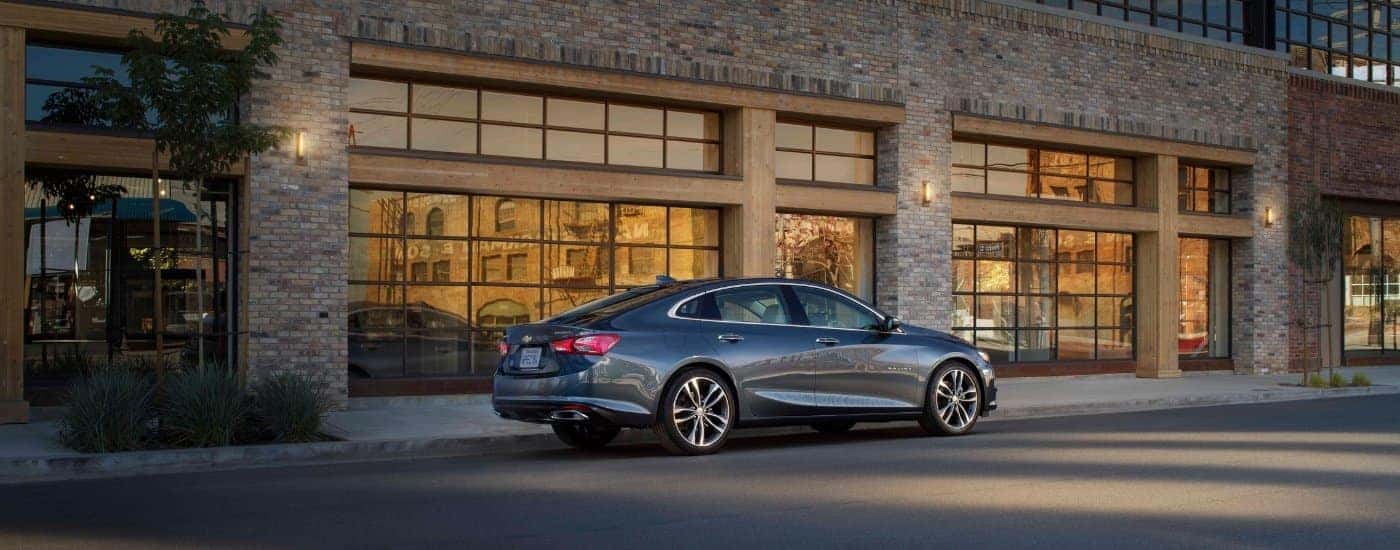 A grey 2019 Chevy Malibu for sale in Louisville from the side.
