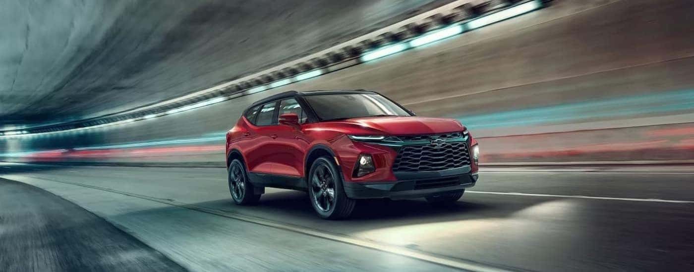 Red 2022 Chevy Blazer driving through a tunnel.