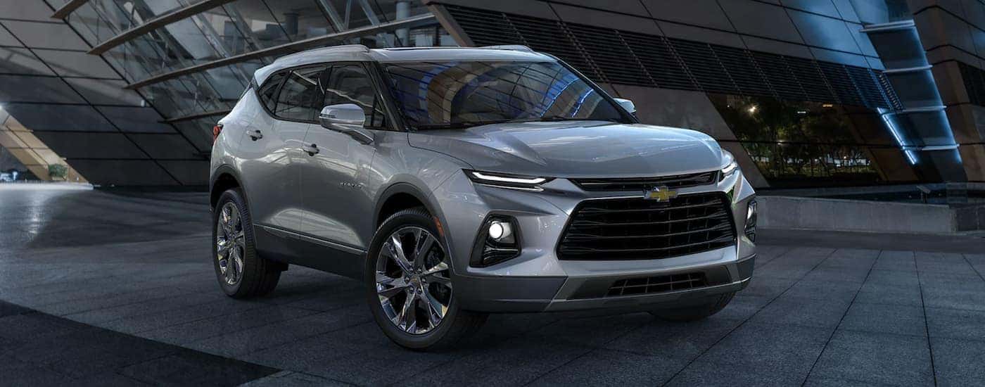 Silver 2022 Chevy Blazer parked outside a building.