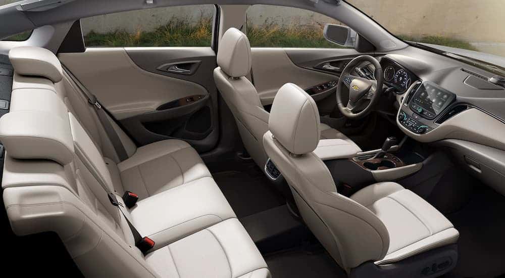 White interior and infotainment system on a 2020 Chevy Malibu for sale near Louisville.