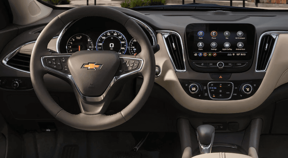 Steering wheel, digital gauge cluster, and infotainment system on a 2021 Chevy Malibu for sale in Nashville.
