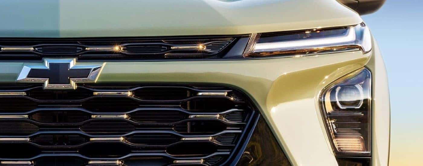 Grille and headlight of a green 2024 Chevy Trax ACTIV