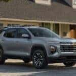 A silver 2025 Chevy Equinox for sale parked on a driveway.