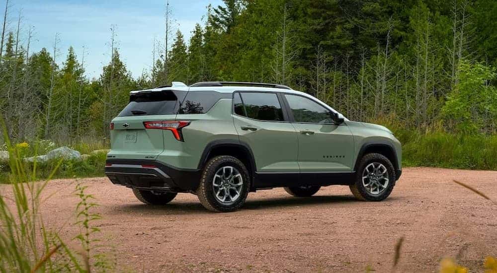 A green 2025 Chevy Equinox ACTIV parked off-road.