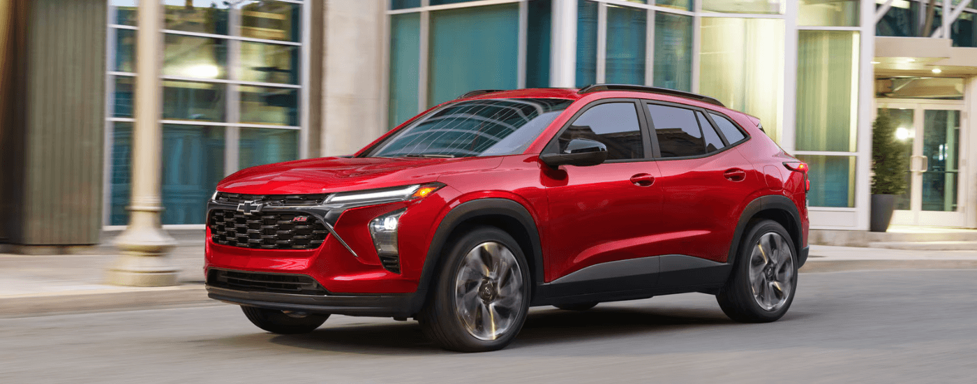 Red 2025 Chevy Trax RS driving down the street