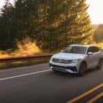 White 2022 Volkswagen Tiguan rounding a bend