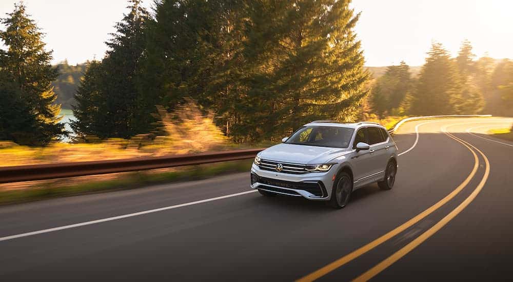 White 2022 Volkswagen Tiguan rounding a bend