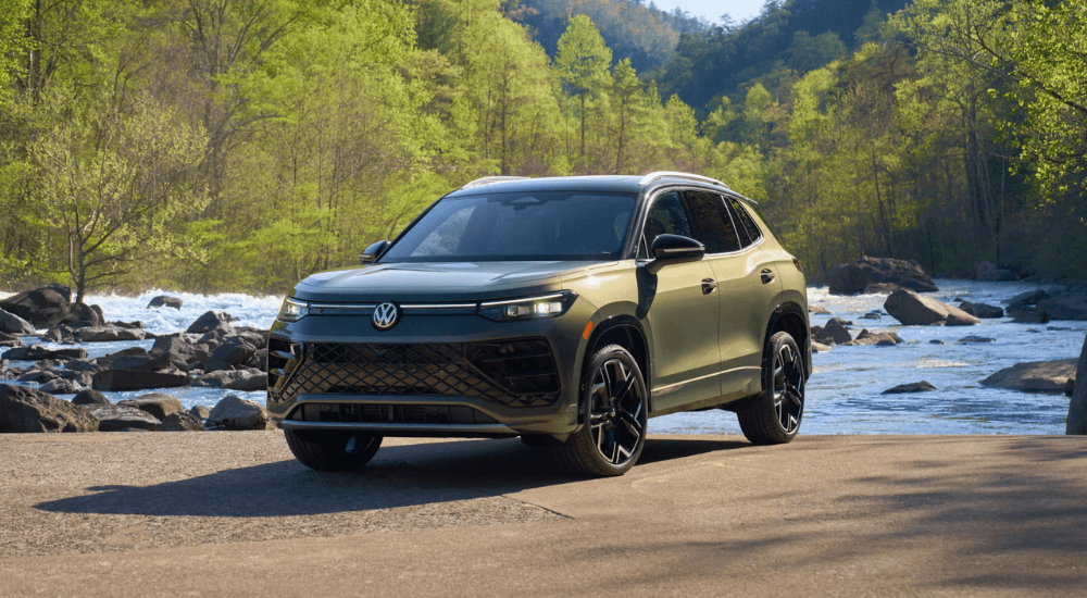 Green 2026 Volkswagen Tiguan parked by a river