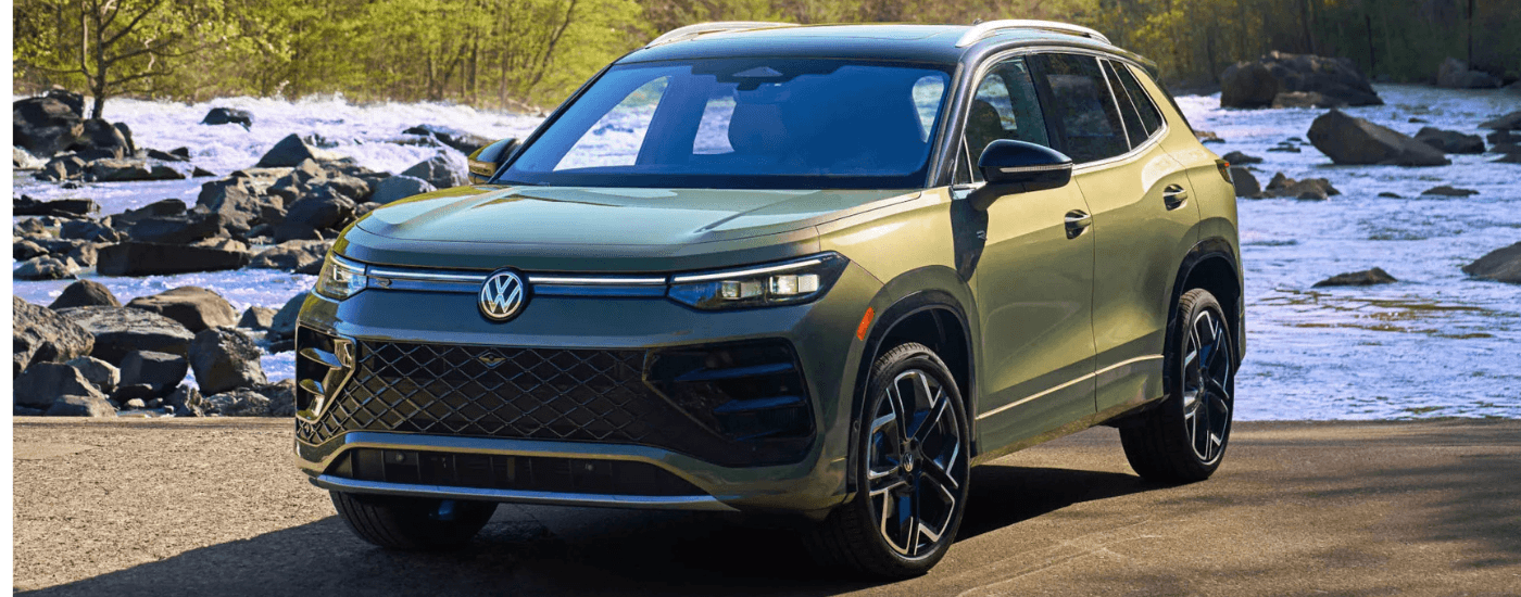 Green 2026 Volkswagen Tiguan parked by water