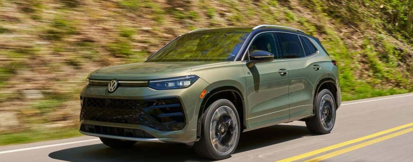 A green 2026 Volkswagen Tiguan driving for sale in Cleveland