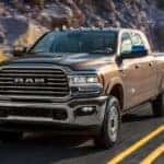 A brown 2020 Ram 2500 driving down a highway