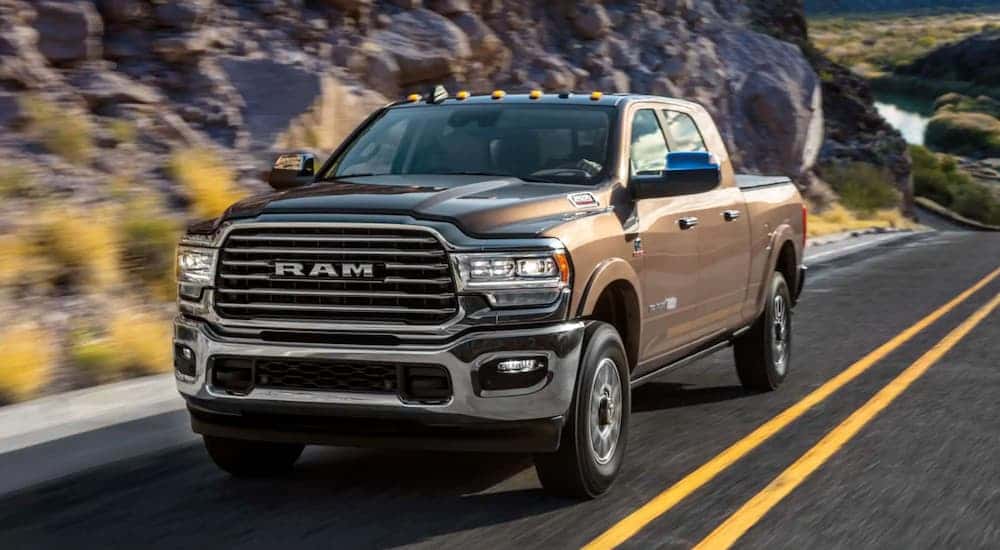 A brown 2020 Ram 2500 driving down a highway