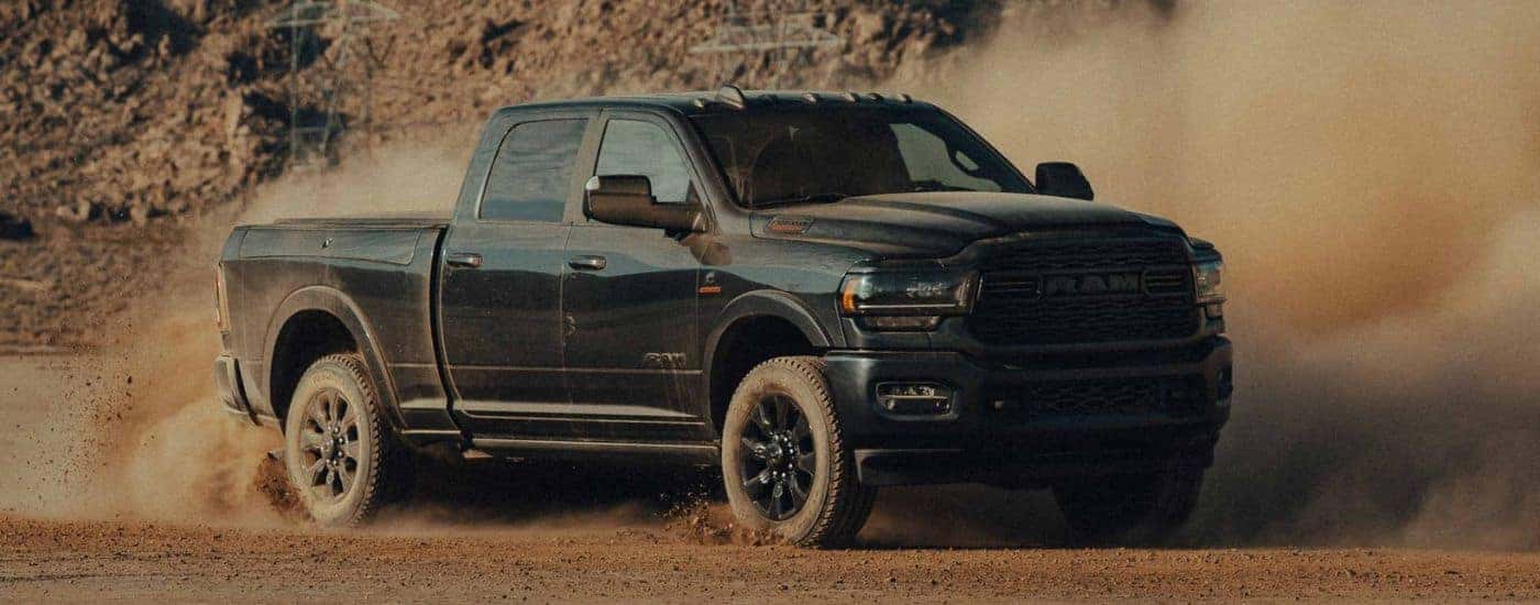 Black 2022 Ram 2500 drifting off-road