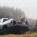A photographer standing near a 2022 Ram 2500 for sale.