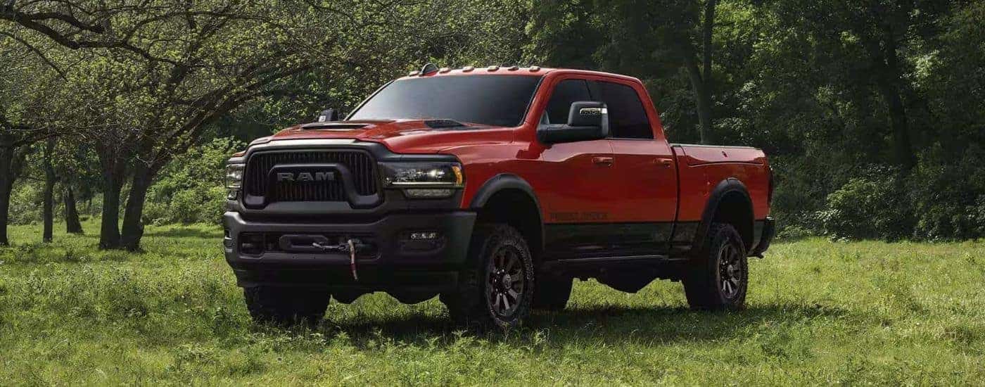 Orange 2024 Ram 2500 Power Wagon for sale parked on grass
