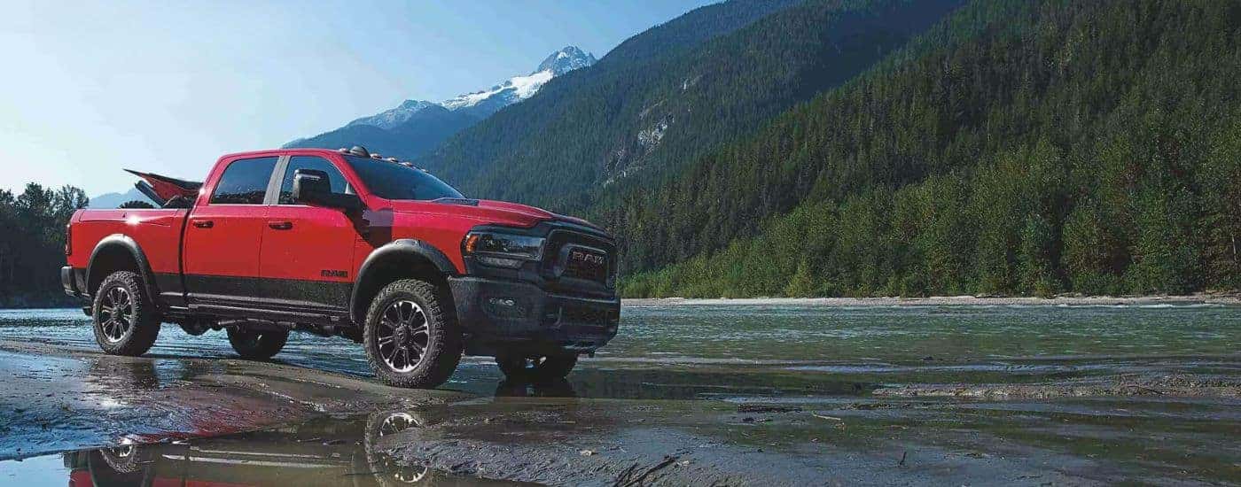 Red 2024 Ram 2500 Rebel parked off-road