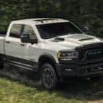 A white 2024 Ram 2500 off-roading on a trail for sale