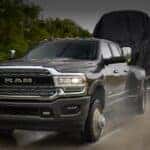 Black 2020 used Ram 2500 for sale towing a trailer.