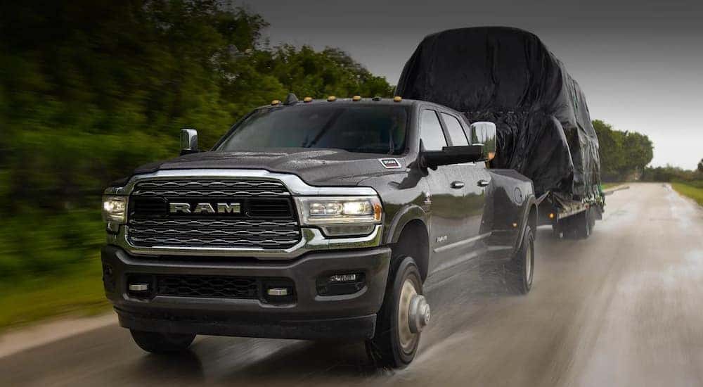 Black 2020 used Ram 2500 for sale towing a trailer.