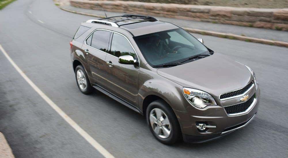 Grey 2012 Chevy Equinox LTZ driving down a road.