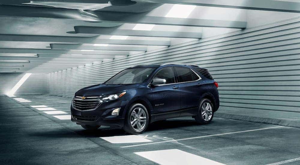 Dark blue 2021 Chevy Equinox parked in a parking garage.