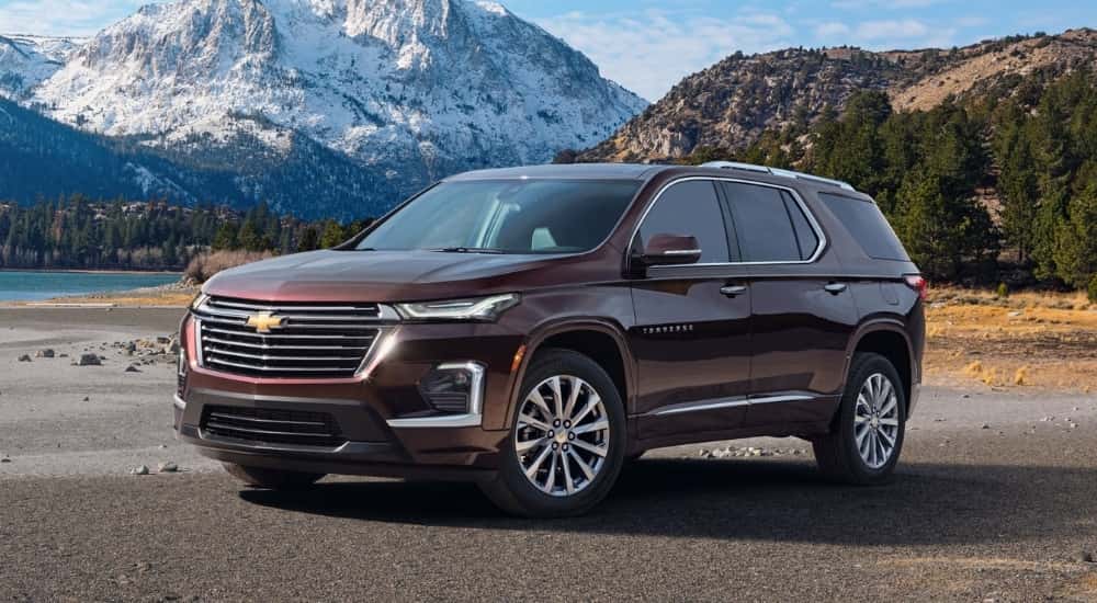 Brown 2022 Chevy Traverse parked near a lake.