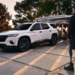 White 2023 Chevy Traverse parked on a driveway.