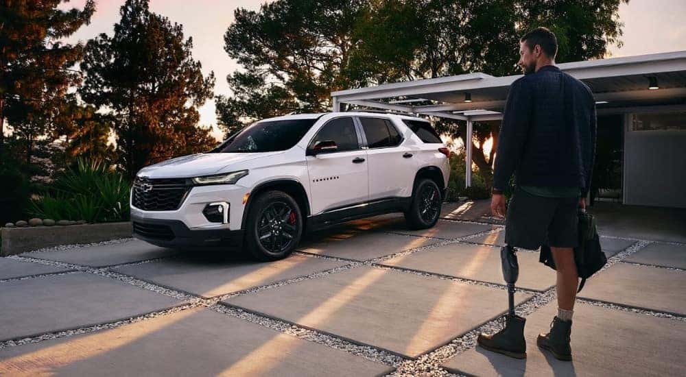 White 2023 Chevy Traverse parked on a driveway.