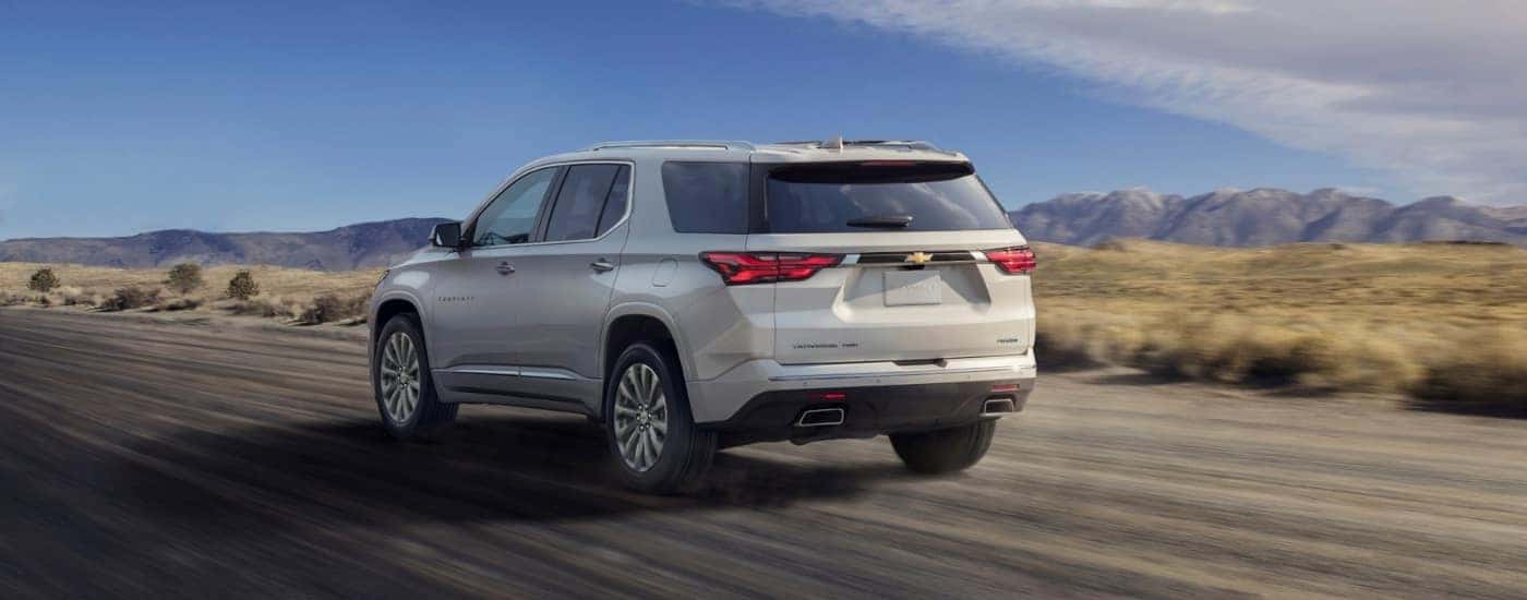 A white 2022 Chevy Traverse driving down a highway