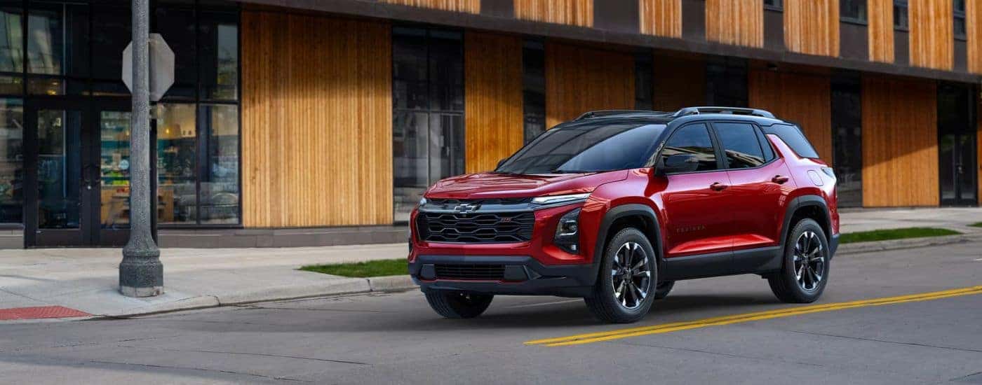 A red 2025 Chevy Equinox RS parked for sale in Dallas