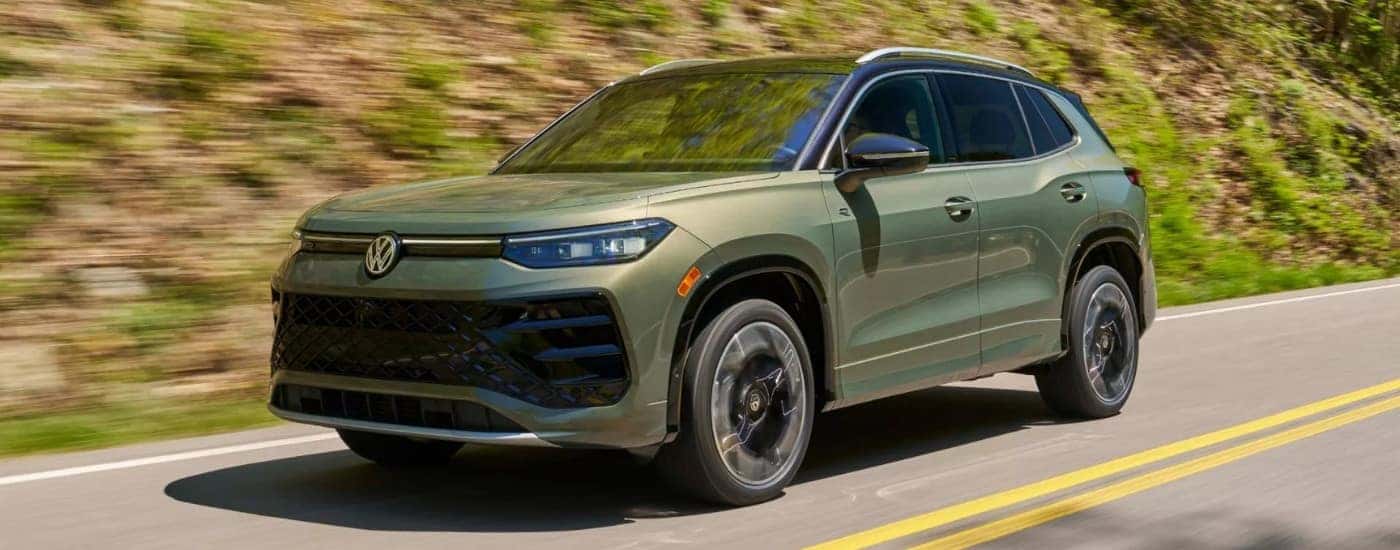 Green 2026 Volkswagen Tiguan SEL R-Line Turbo driving on a open road