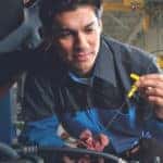 Mopar service tech checks engine fluids