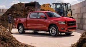 A red 2021 Ram 1500 is shown from the side.