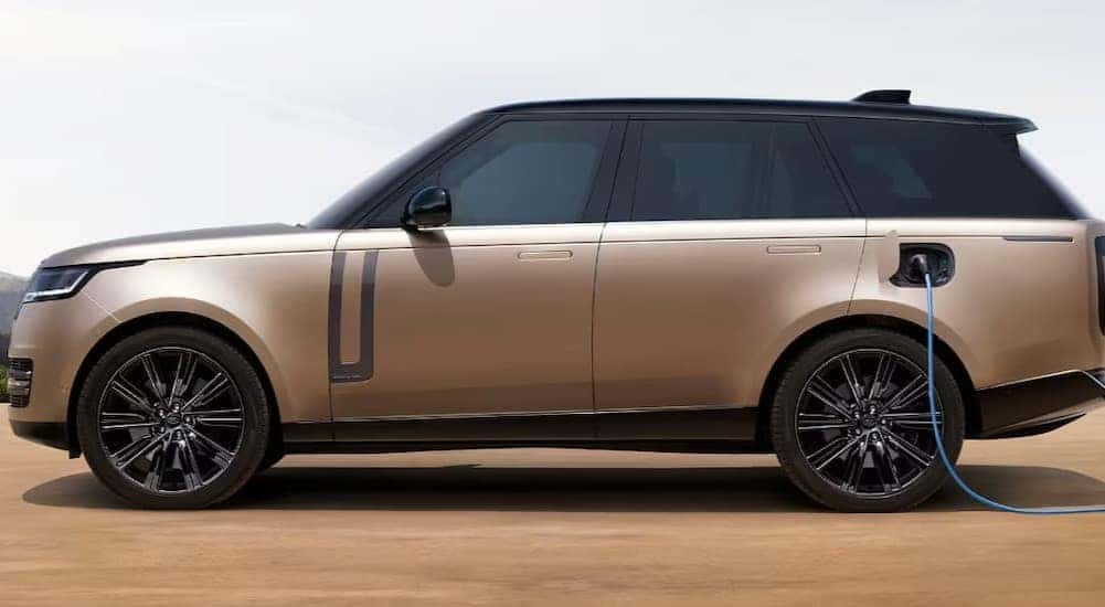 Bronze 2023 Land Rover Range Rover plugged in and charging.