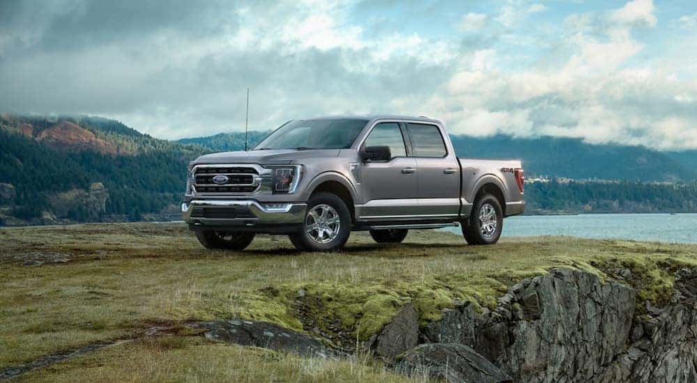 Silver 2021 Ford F-150 parked on a hill after viewing used cars for sale near Rensselaer