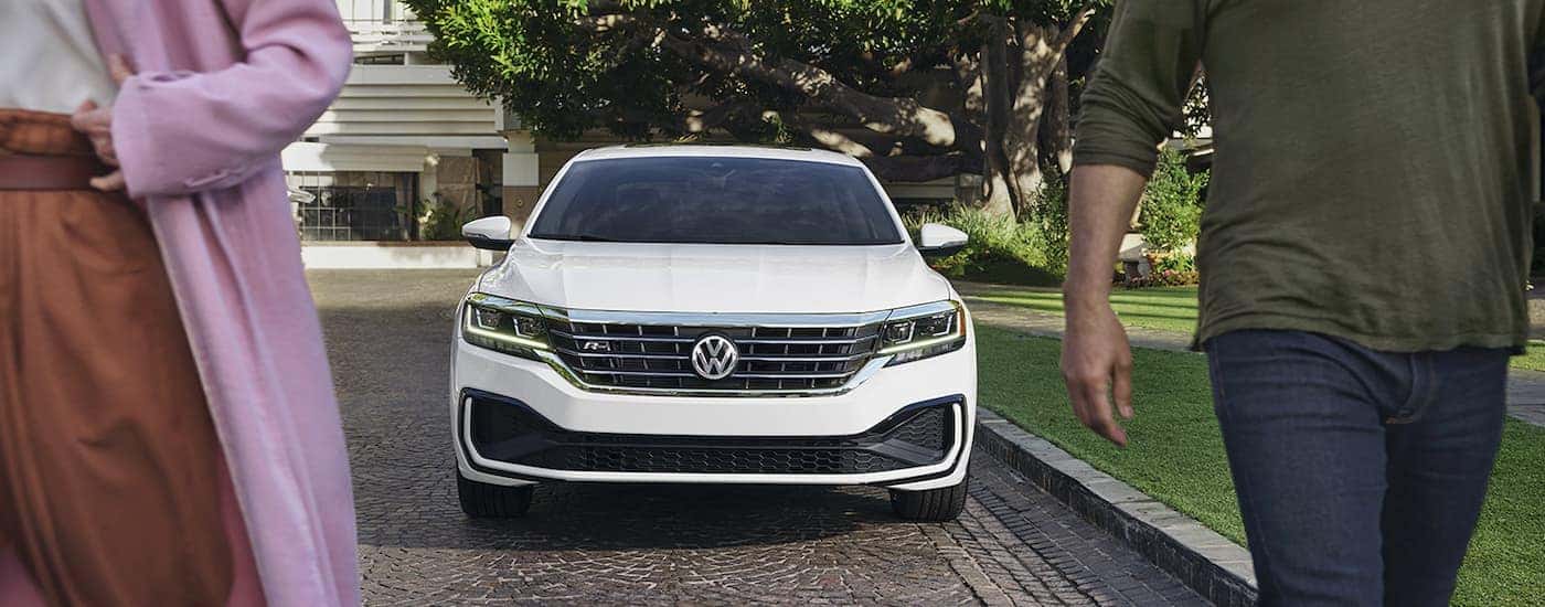 A white 2022 Volkswagen Passat R-Line is shown parked on a driveway.
