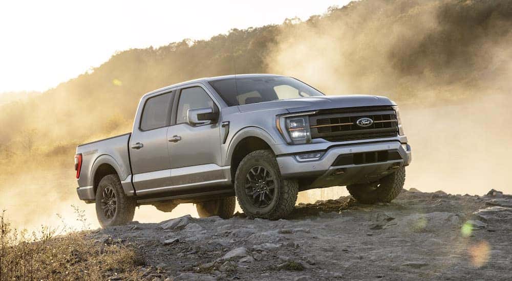 Silver 2021 Ford F-150 Tremor parked on a dirt hill.