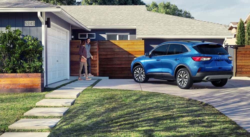 A blue 2022 Ford Escape from the rear at an angle.