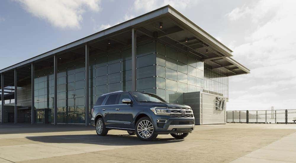 A blue 2024 Ford Expedition from the side.