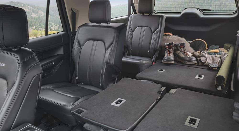 The black interior of a 2024 Ford Expedition from the front seats.