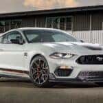 A white 2023 Ford Mustang Mach 1 from the front at an angle.